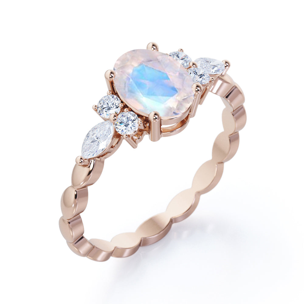 Scalloped Rope Design 1.15 carat Oval cut Moonstone and diamond 7 stone engagement ring in White gold