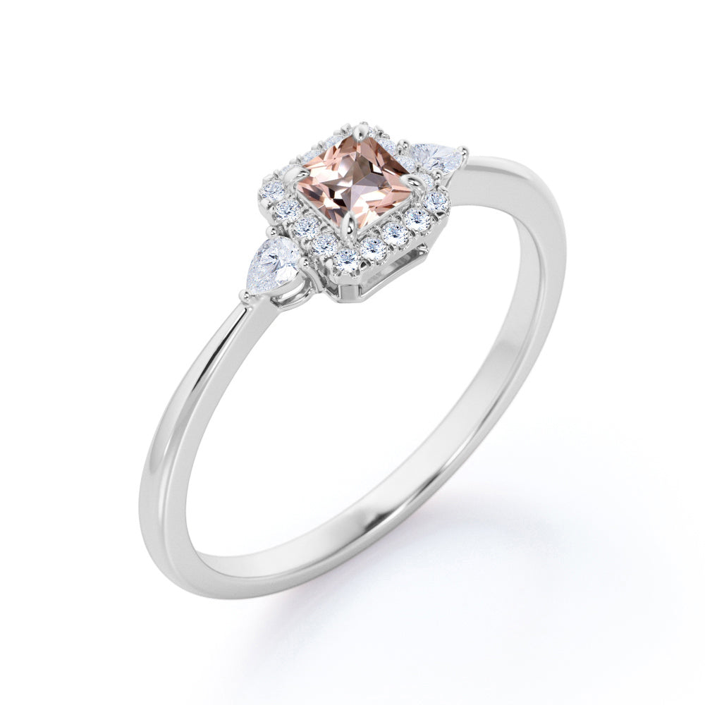 Exquisite three stone 0.75 carat Princess cut Peach Pink Morganite and diamond tapered style anniversary ring in Yellow gold