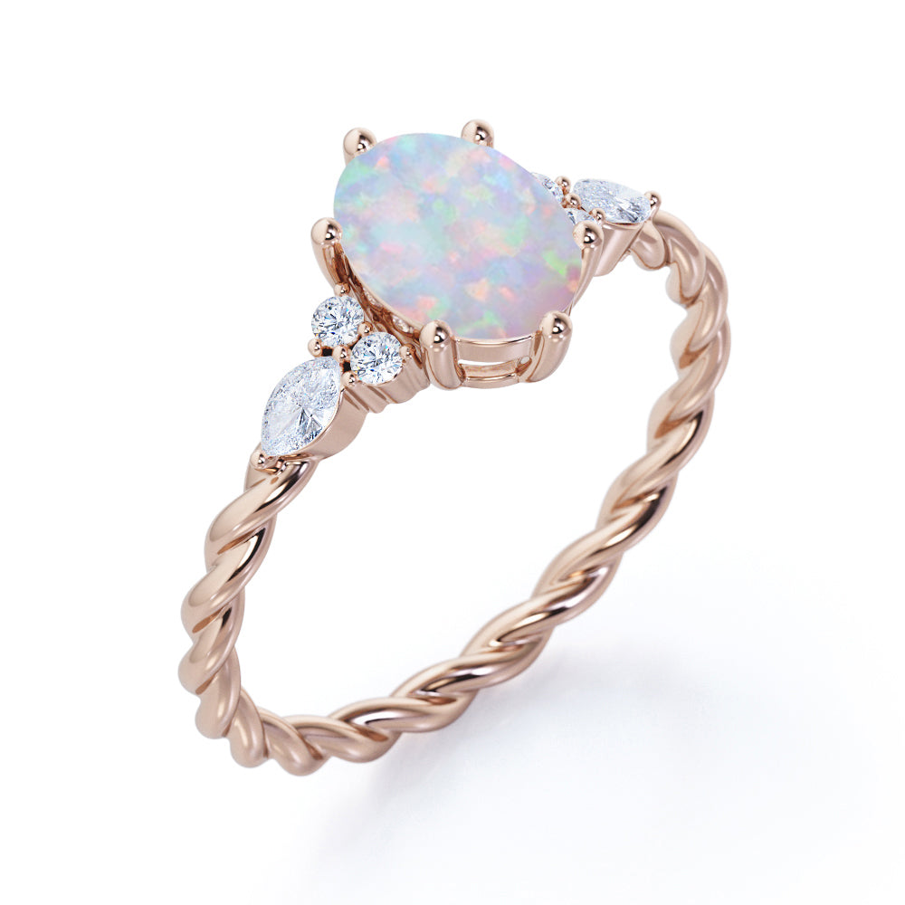 Twisted style 1.25 carat Oval shaped Opal and diamond 6 prong engagement ring in White gold