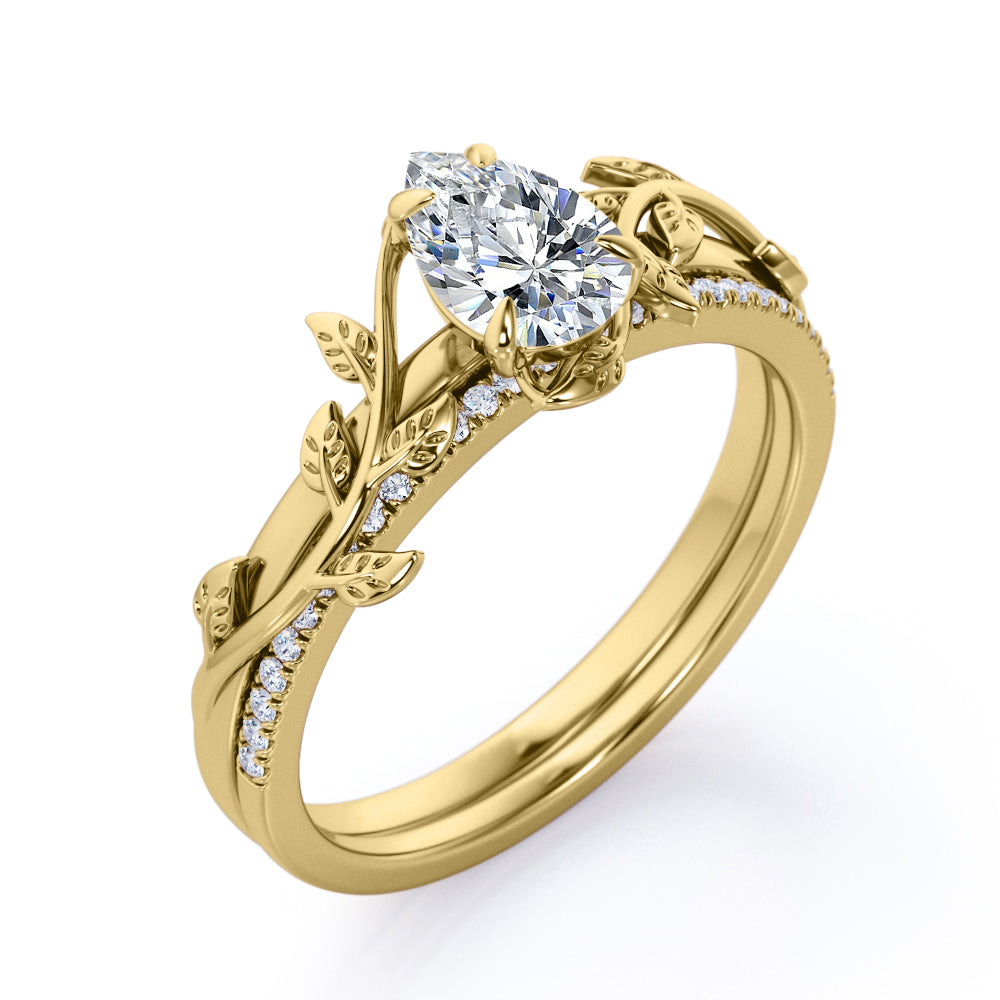 Stylish nature inspired 1.25 carat Pear cut Moissanite and diamond pave set wedding ring set for women