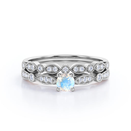 Double Milgrain 1.5 carat Round cut Rainbow Moonstone and diamond cathedral pave engagement ring in White gold