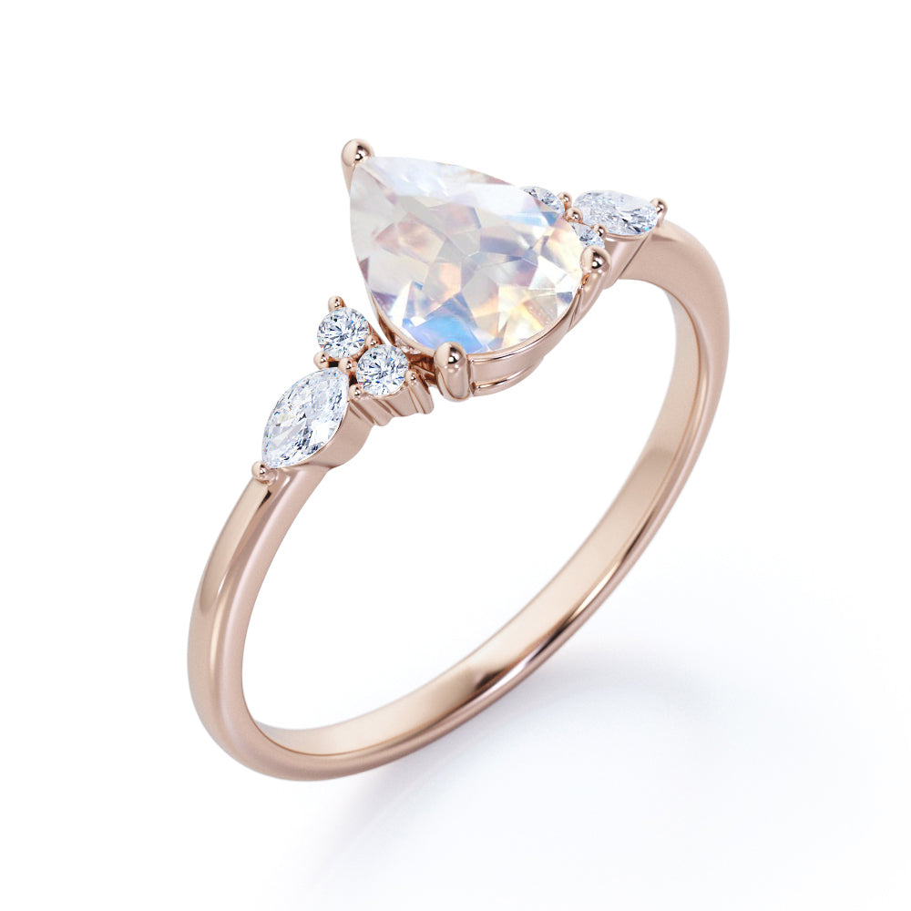 Art Deco inspired 1.2 carat Pear shaped Moonstone and diamond multistone engagement ring in Rose gold