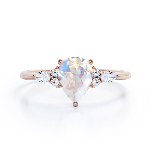 Art Deco inspired 1.2 carat Pear shaped Moonstone and diamond multistone engagement ring in Rose gold