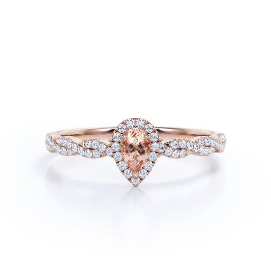 Twisted halo 1 carat Pear cut Morganite and diamond infinity engagement ring in Rose gold