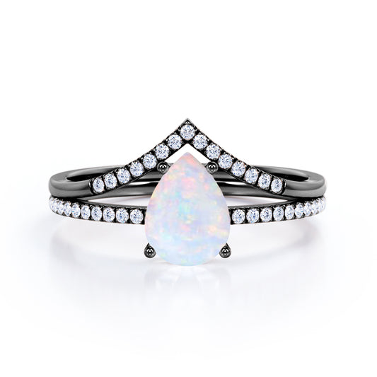 Chevron contour 1.35 carat Pear shaped Ethiopian Opal and diamond-pave set-4 prong Bridal set for women in Black gold