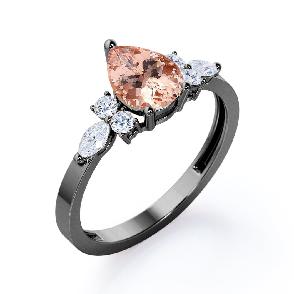 Classic 7 stone 1.25 carat Pear shaped Morganite and diamond marquise and dot engagement ring in Black gold