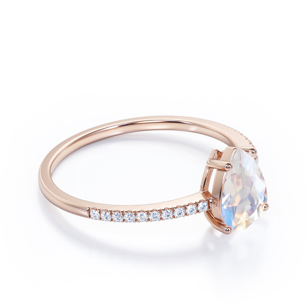Affordable 1.25 carat Pear shaped Moonstone and diamond half-eternity engagement ring in Rose gold