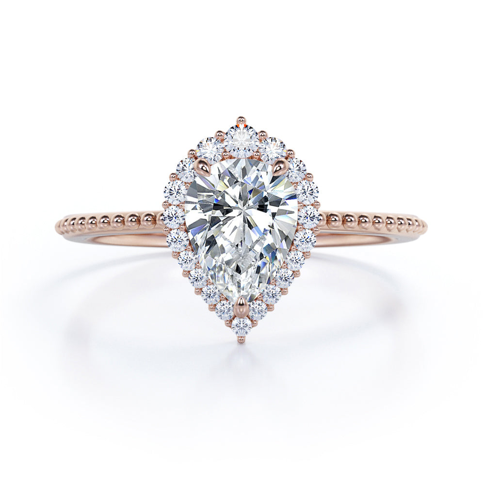 Eccentric halo 1.25 carat Pear shaped Moissanite and diamond vintage milgrain engagement ring in Rose gold