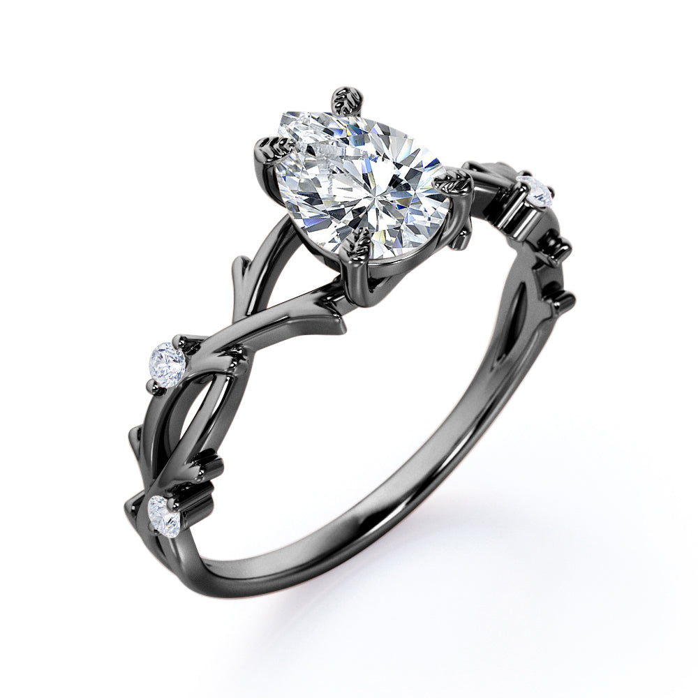 Artistic twig inspired 1 carat Pear cut Moissanite and diamond earthy engagement ring in Black gold
