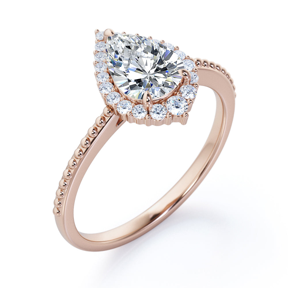 Eccentric halo 1.25 carat Pear shaped Moissanite and diamond vintage milgrain engagement ring in Rose gold