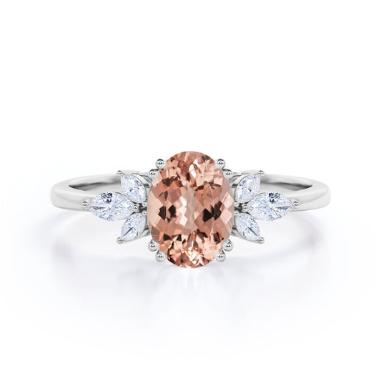 Double Prong 1.25 carat Oval Shaped Morganite and Marquise diamond engagement ring in White gold