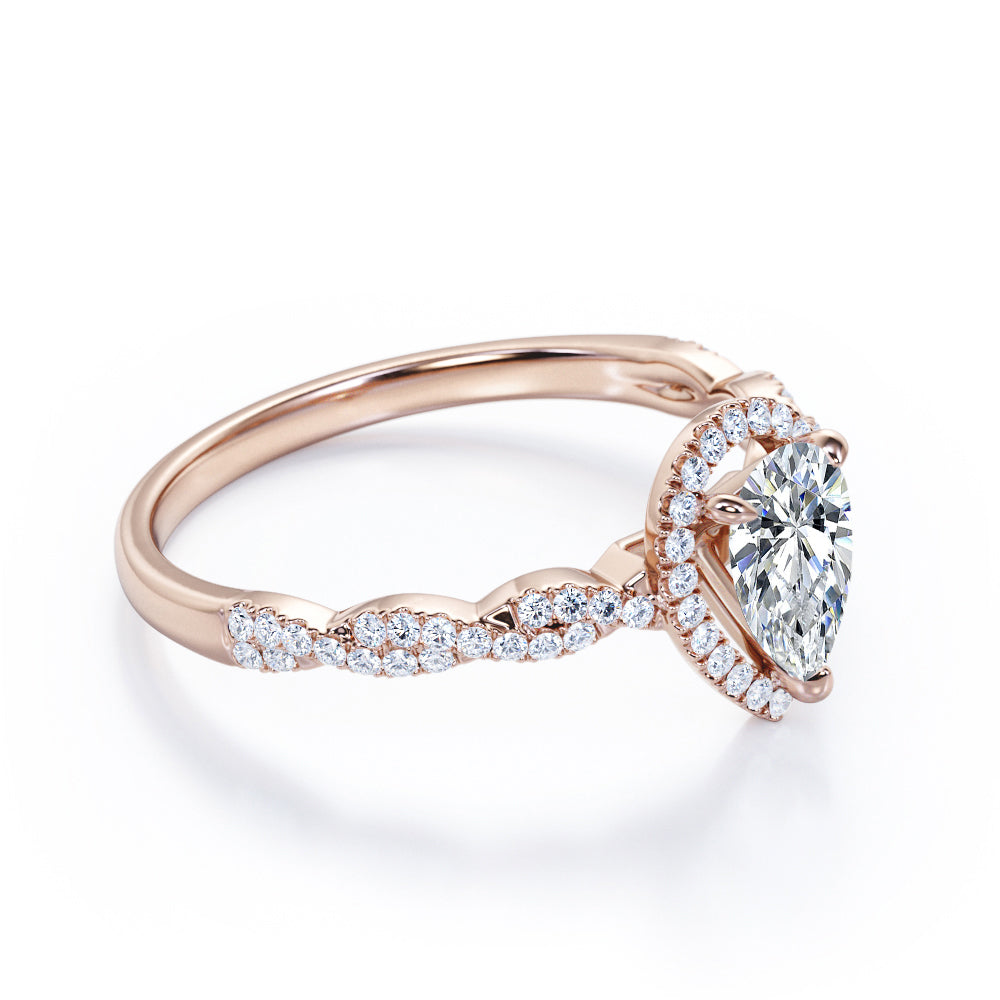 Twisted rope style 1.5 carat Pear cut Moissanite and diamond infinity halo engagement ring in Rose gold