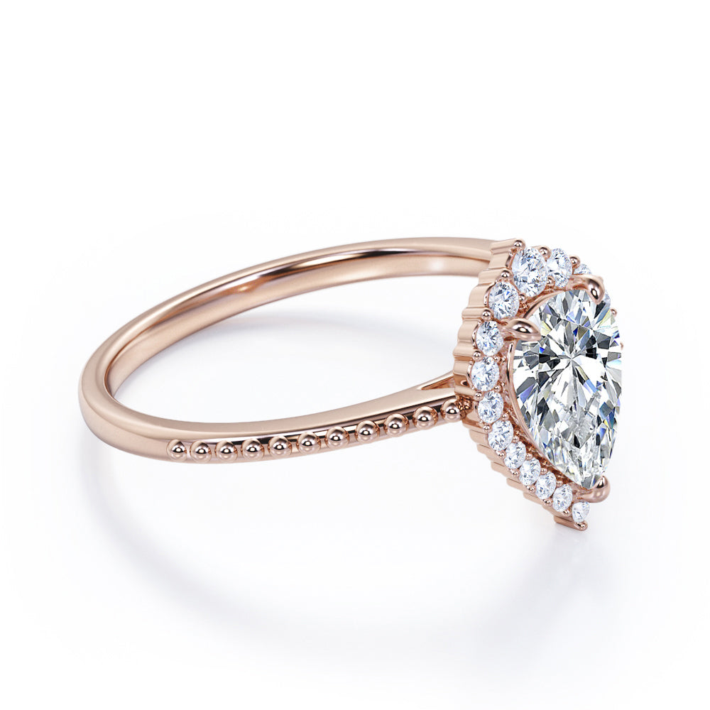 Eccentric halo 1.25 carat Pear shaped Moissanite and diamond vintage milgrain engagement ring in Rose gold