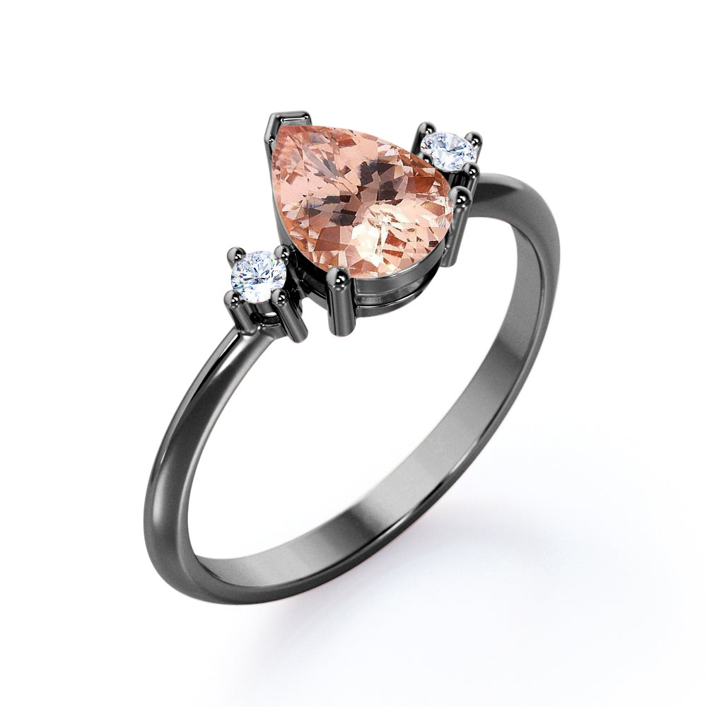 Three prong setting 1.1 carat Pear shaped Morganite and diamond trilogy anniversary ring for women in Black gold