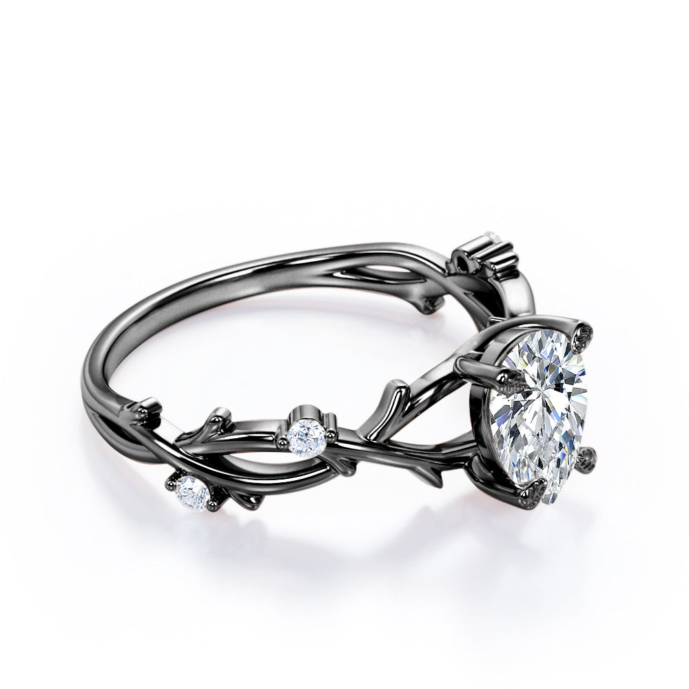 Artistic twig inspired 1 carat Pear cut Moissanite and diamond earthy engagement ring in Black gold