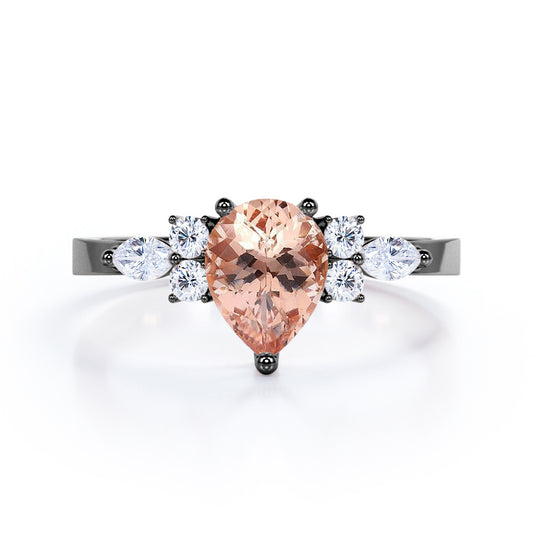 Classic 7 stone 1.25 carat Pear shaped Morganite and diamond marquise and dot engagement ring in Black gold