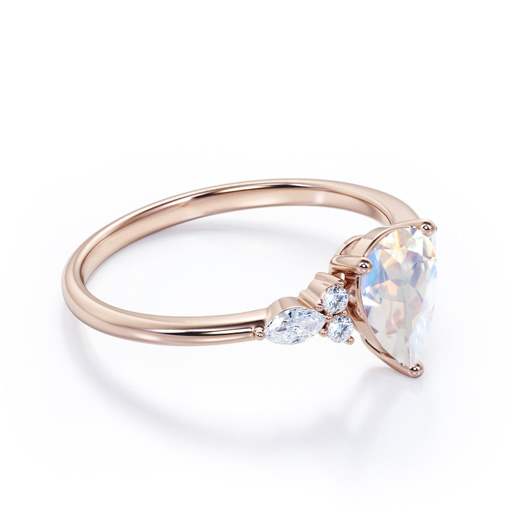 Art Deco inspired 1.2 carat Pear shaped Moonstone and diamond multistone engagement ring in Rose gold