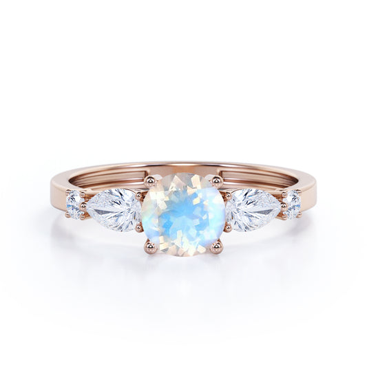 Modern 1.15 carat Round cut Blue Moonstone and diamond marquise 5 stone engagement ring in Rose gold