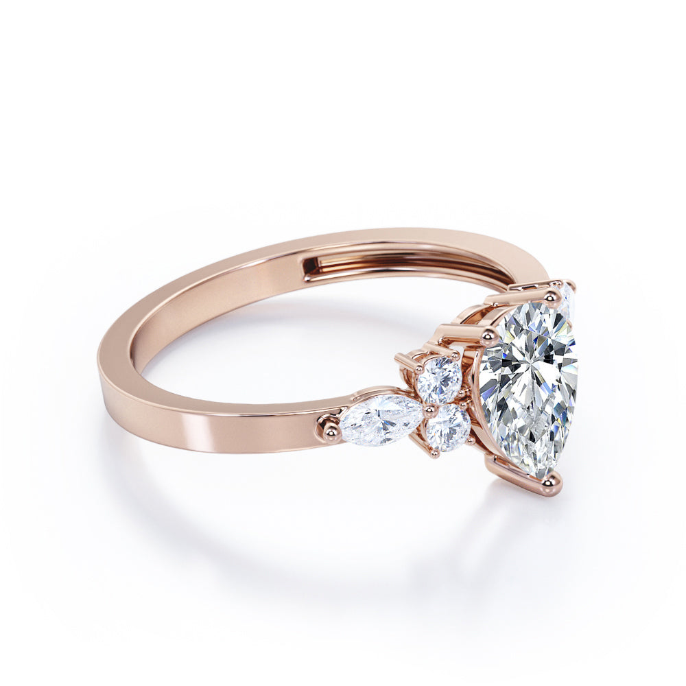 Antique 7 stone 1.1 carat Pear Shaped Moissanite and diamond 3 prong engagement ring in Rose gold