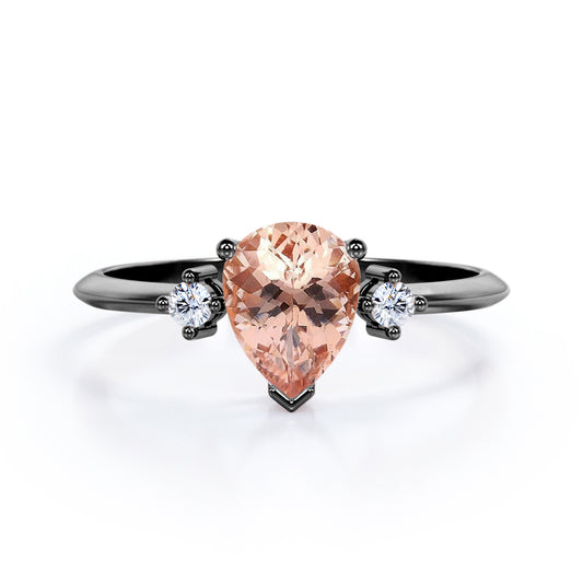 Three prong setting 1.1 carat Pear shaped Morganite and diamond trilogy anniversary ring for women in Black gold